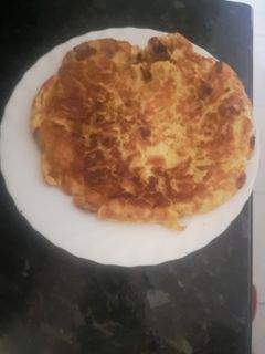 Una foto de Tortilla de patatas y cebolleta