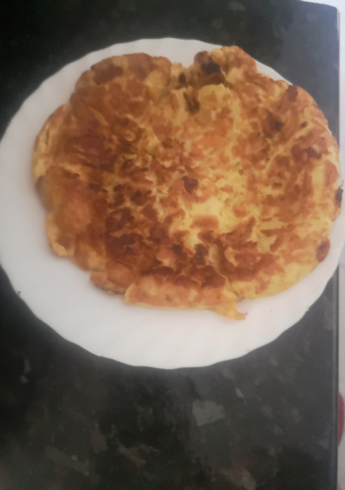 Una foto de Tortilla de patatas y cebolleta