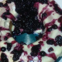 A picture of Yellow cake w Blueberry-Pineapple sauce.