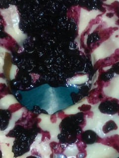 A picture of Yellow cake w Blueberry-Pineapple sauce.