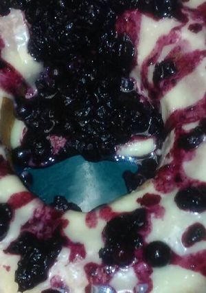 A picture of Yellow cake w Blueberry-Pineapple sauce.
