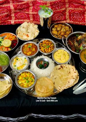 A picture of Traditional Gujarati Satvik Lunch Thali (festive and complete meal)- Garvi Gujarat.