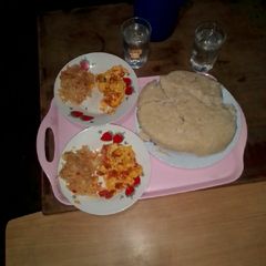 A picture of Prepared Ugali cabbage and fried eggs.