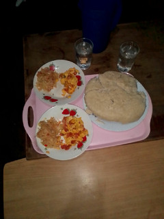 A picture of Prepared Ugali cabbage and fried eggs.
