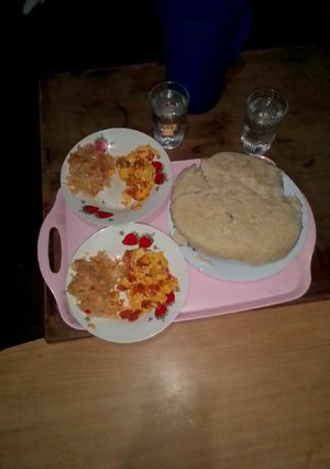 A picture of Prepared Ugali cabbage and fried eggs.