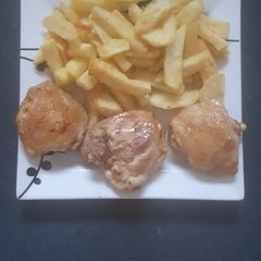 A picture of Chicken Thighs and Chips.