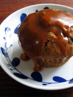 A picture of Sticky Date Cupcakes with Caramel Sauce.
