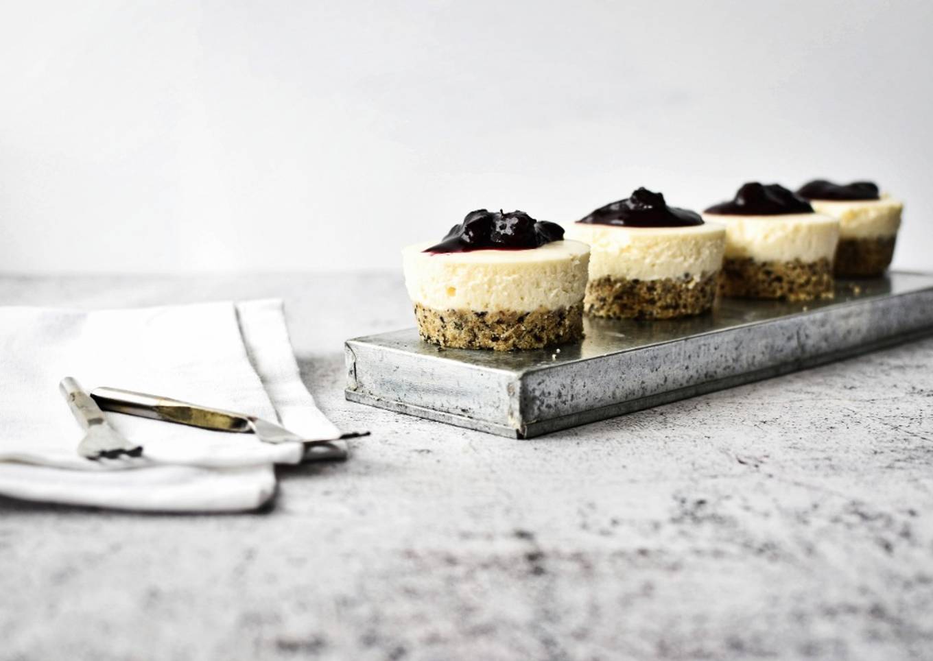 Mini No Bake Cheesecakes with Seeded Base and Blueberry Compote Topping