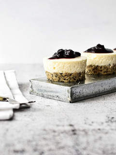 A picture of Mini No Bake Cheesecakes with Seeded Base and Blueberry Compote Topping.