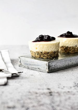 A picture of Mini No Bake Cheesecakes with Seeded Base and Blueberry Compote Topping.