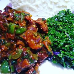 A picture of Pork, sukumawiki and ugali.