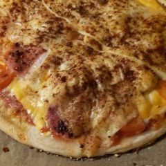 A picture of My cheese bacon pepperoni pizza.