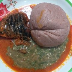 A picture of Red corn swallow with okra and fish stew.