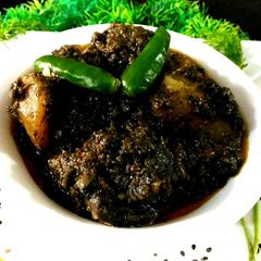 A picture of Chicken with black sesame seeds.