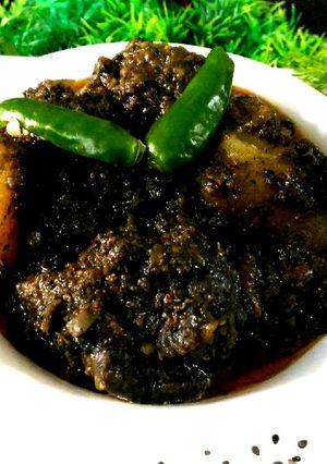 A picture of Chicken with black sesame seeds.