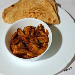 A picture of Raw Banana Masala Sabzi with Layered Paratha.