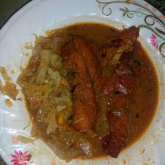 A picture of Fish fillet and cabbage With ugali.