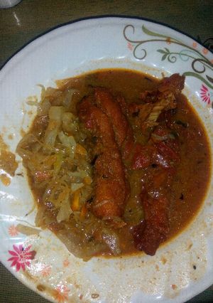 A picture of Fish fillet and cabbage With ugali.