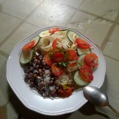 A picture of Rice nd beans with simple salad.
