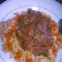 A picture of Beef stew and brown rice.