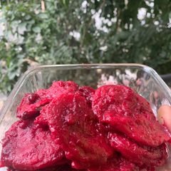 A picture of Ravioli in Beetroot sauce.