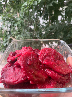 A picture of Ravioli in Beetroot sauce.