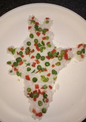 A picture of Boiled rice with veggies.