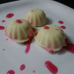 A picture of Strawberry Sandesh in White Chocolate Shells.
