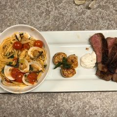 A picture of Garlic Clam Pasta w/ Rib-eye & Scallops.