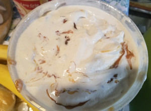 A picture of Butter pecan ice cream with caramel.
