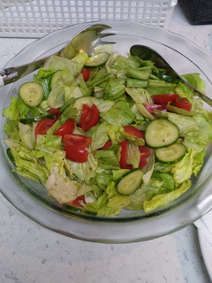 A picture of Lettuce cucumber tomatoes salad.