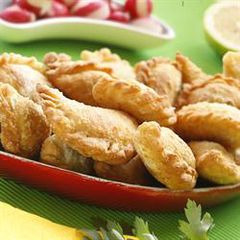 Half-moon shaped meat turnovers - sambousek bi lahmeh A picture of Half-moon shaped meat turnovers - sambousek bi lahmeh.