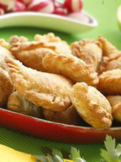 A picture of Half-moon shaped meat turnovers - sambousek bi lahmeh.