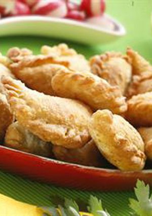 A picture of Half-moon shaped meat turnovers - sambousek bi lahmeh.