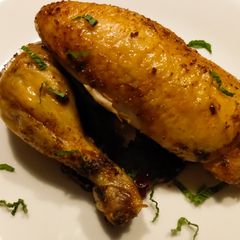 A picture of Roast chicken with lingonberry mint sauce.