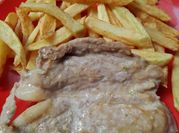 Una foto de churrasco chancho