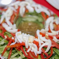 A picture of Vegetables salad with venigrate dressing.