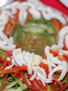 A picture of Vegetables salad with venigrate dressing.