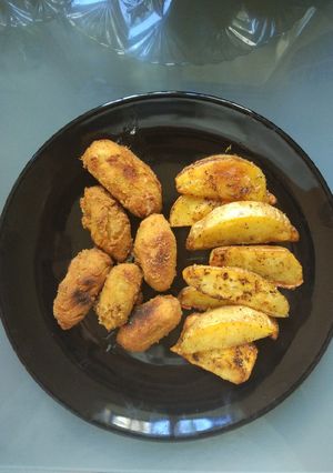 A picture of Cocido Croquettes and Deluxe-Style Potato Wedges.