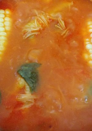 A picture of Noodle Soup with Corn or Vegetables.