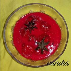 Honey dew banana in red milk sauce A picture of Honey dew banana in red milk sauce.