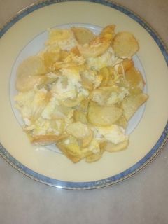 Una foto de Patatas con huevos revueltos