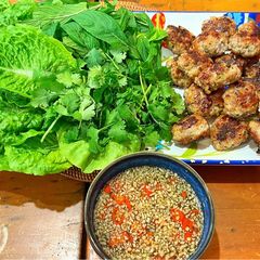 A picture of Meatballs with nouc cham, cucumber and mint.