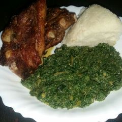 Grilled Pork Chops, Creamed Pumpkin Leaves and Ugali A picture of Grilled Pork Chops, Creamed Pumpkin Leaves and Ugali.
