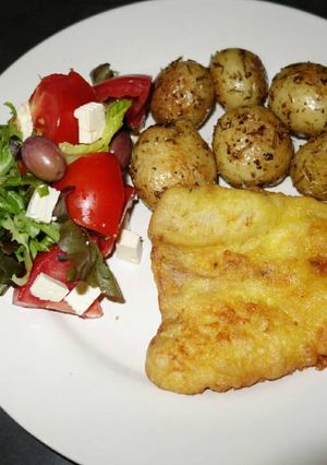 A picture of Beer batter Fish with Rosemary baked potatoes.