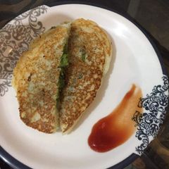 A picture of Suji (semolina) stuffed peas pancake.