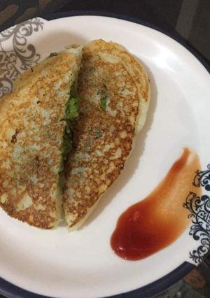 A picture of Suji (semolina) stuffed peas pancake.
