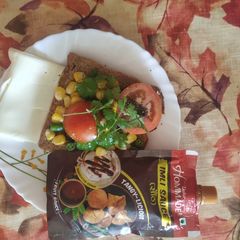 A picture of Open cheese, corn and capsicum sandwich!.