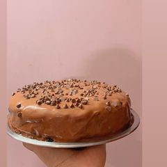 Moist eggless chocolate cake in cooker A picture of Moist eggless chocolate cake in cooker.