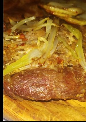 Una foto de Churrazco con cebolla frita🍽🤤